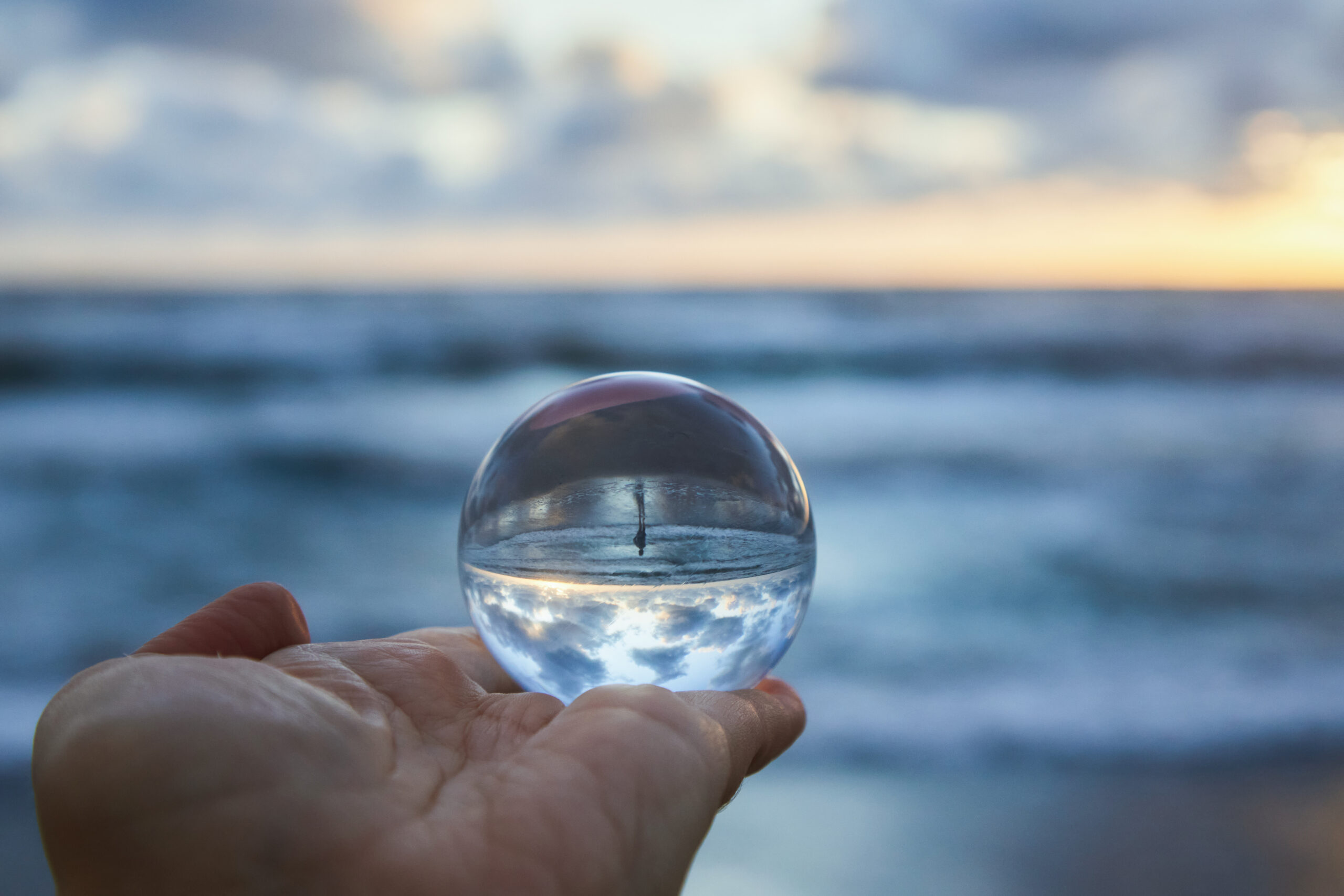 Magic sphere. Fortune teller, mind power concept. Crystal Ball reflecting water and sky